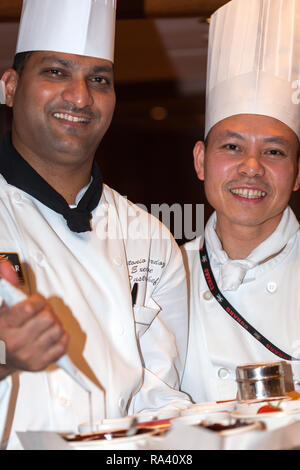Two pastry chefs after demonstrations of their Skills. Queen Victoria Cunard Ship Stock Photo