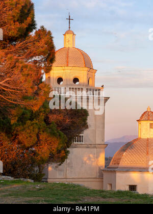 San Lorenzo bell tower and dome, Portovenere, Liguria, ITaly. Beautiful winter evening sunset. Stock Photo