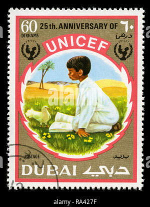 Postage stamp from the Dubai in the United Arab Emirates in the UNICEF, 25th Anniversary series issued in 1971 Stock Photo