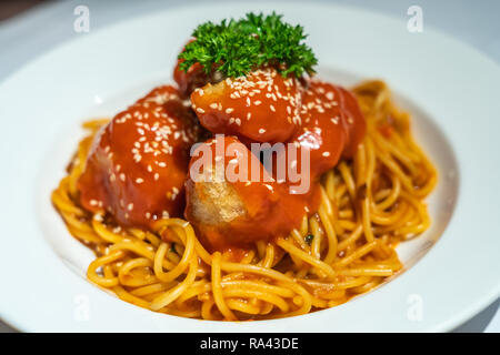 Italian Spaghetti fried chicken cubes Stock Photo