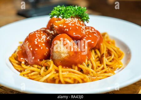 Spaghetti fried chicken cubes Stock Photo