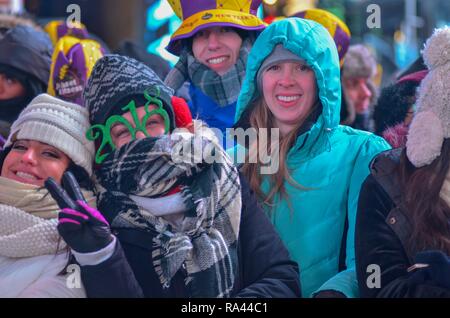 New York, United States. 31st Dec, 2017. New York, NY. December 31, 2017: Participants seen wearing 2018 glasses during New Year's Eve celebrations in Times Square on December 31, 2017 in New York. Credit: Ryan Rahman/Pacific Press/Alamy Live News Stock Photo