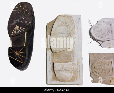 Plaster cast of shoe sole tread from criminal's shoes taken at crime scene for criminal investigation Stock Photo