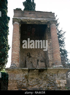 Italy. Pompeii. Necropolis of Nocera Gate. Located on the sides of a road that runs parallel with the city walls. There are several burial monuments. 1st century BC-1st century AD. Tomb 90S of a Magistrate and his wife. Late Republican era. 50-30 AD. Campania. Stock Photo