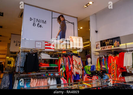 COLOMBO, SRI LANKA - SEPTEMBER 05, 2016:  Wide View of Ladies wear Clothes, Dresses, Skirts, Frocks, Trousers, Jackets, with Shelves, Racks and Hanger Stock Photo