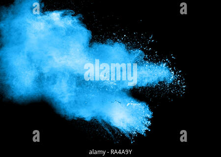 abstract blue dust explosion on  black background .abstract blue powder splattered on black background . Freeze motion of blue powder exploding. Stock Photo