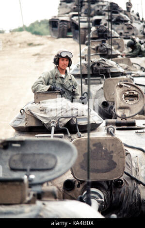 1977 - A convoy of M-60 main battle tanks move out during a training ...