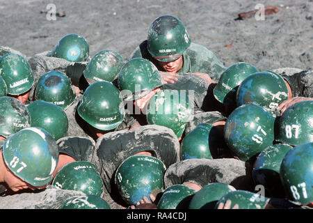 1976 - A U.S. Navy Basic Underwater Demolition/Sea-Air-Land (SEAL) (BUD/S) trainees participate in a 'hell week' exercise.  Phase I of BUD/S training concludes with 'hell week,' when students' physical, emotional and mental abilities are tested under adverse conditions. Stock Photo