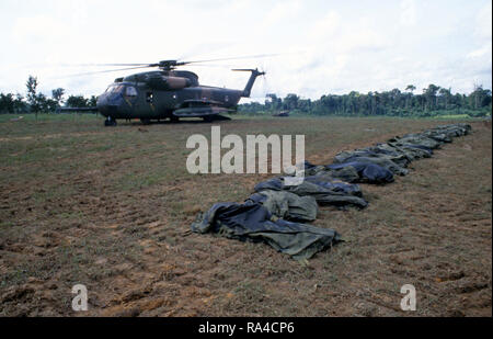 1978 - A US Air Force HH-53 Jolly Green Giant helicopter from the 55th Aerospace Rescue and Recovery Squadron stands by to assist in the removal of the remains of the victims of the Jonestown tragedy. Stock Photo