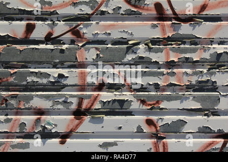 Corrugated iron wall as background with rest of graffiti, Barcelona, Spain Stock Photo