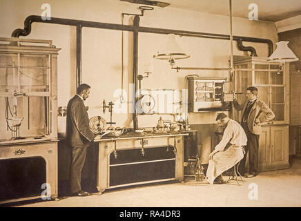 Early twentieth century archival photograph of scientist and police inspectors working in forensic laboratory looking for crime evidence Stock Photo