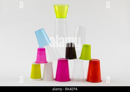Plastic cups, many different types, shapes, colors, disposable cups, plastic waste Stock Photo