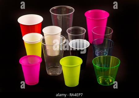 Plastic cups, many different types, shapes, colors, disposable cups, plastic waste Stock Photo