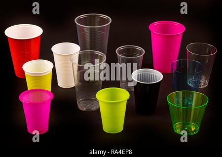 Plastic cups, many different types, shapes, colors, disposable cups, plastic waste Stock Photo