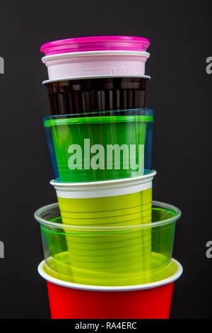 Plastic cups, many different types, shapes, colors, disposable cups, plastic waste Stock Photo