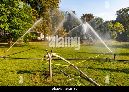 Irrigation of the green areas in the spa garden, Lichtentaler Allee, Baden-Baden, Baden-Württemberg, Germany Stock Photo