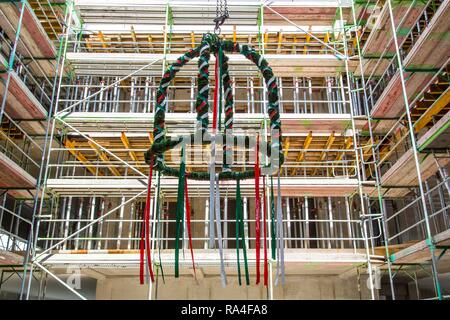 Topping-out ceremony in an office building, topping-out wreath In the construction site, Germany Stock Photo