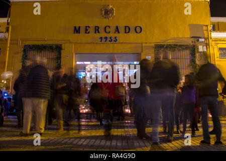 NIGHT PHOTO OF A STREET LOCAL MARKET WITH MANY PEOPLE Stock Photo