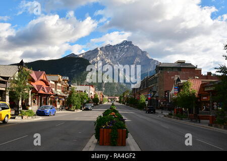 Main street of Banff Alberta with Mount Norquay in the background. Stock Photo