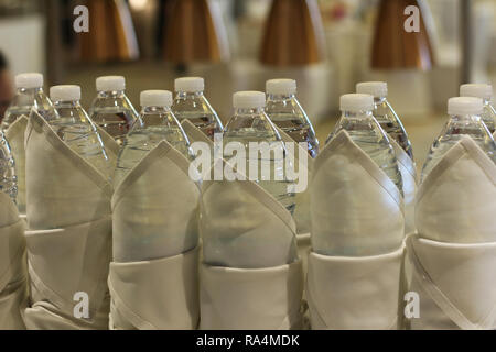 bottled drinking water warped in cloth Stock Photo