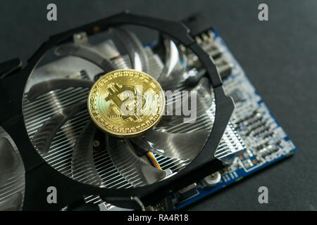 Bitcoin coin on GPU, Cryptocurrency Mining Using Graphic Cards Stock Photo
