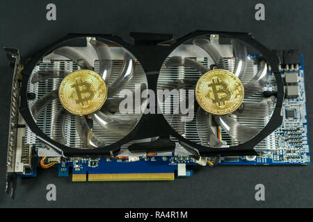 Bitcoin coin on GPU, Cryptocurrency Mining Using Graphic Cards Stock Photo