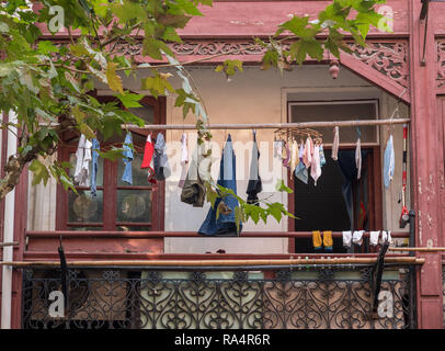 Clothing hanging out to dry outside traditional chinese apartment Stock Photo
