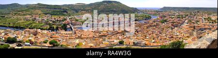 Bosa, Sardinia / Italy - 2018/08/13: Panoramic view of the historic town of Bosa at the western coast of Sardegna by the Fiume Temo river and Bosa Marina in the background