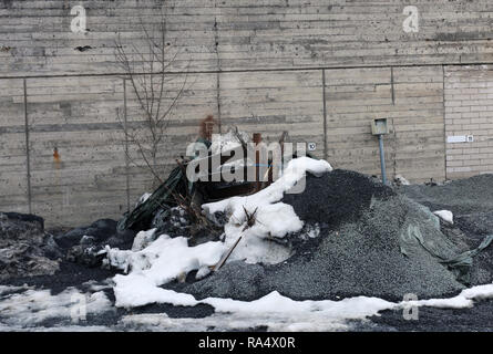 Details from an abandoned area including abandoned buildings and parking area. Photographed during a winter day with some snow. Stock Photo