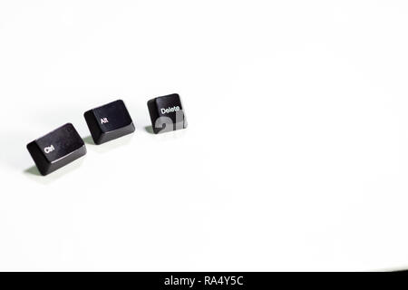 Loose Ctrl Alt Delete computer keys on white background Stock Photo