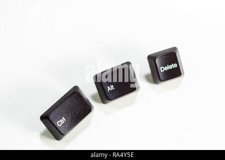 Loose Ctrl Alt Delete computer keys on white background Stock Photo