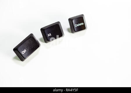 Loose Ctrl Alt Delete computer keys on white background Stock Photo