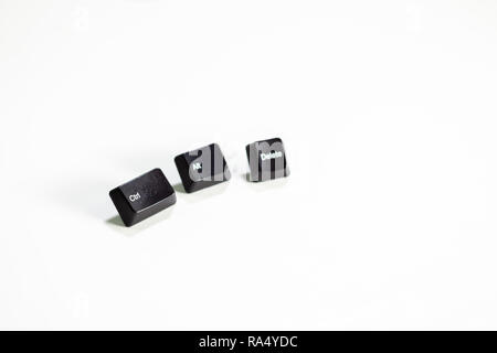 Loose Ctrl Alt Delete computer keys on white background Stock Photo