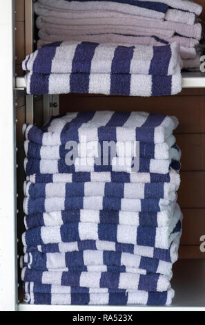 Stack of blue and white folded towels Stock Photo