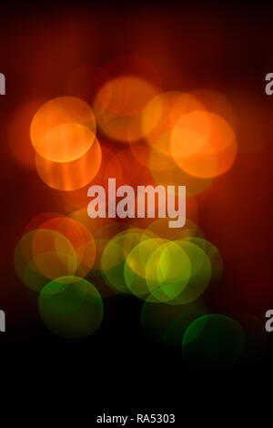Round bokeh in red, yellow, green tones close up on New Year's Eve 2018 Stock Photo