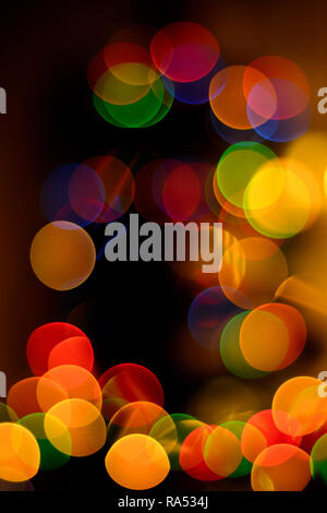 blurred circles of the bokeh in festive heat-cold colors of yellow, cypress, green and blue 2018 Stock Photo