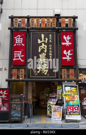 Fukuoka, Japan- November 18, 2018: Front entrance of an Izakaya, Japanese style bar with signboards of served food and liqour Stock Photo