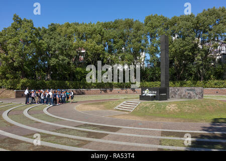 Nagasaki, Japan - October 25, 2018: Students in front of the monument that marks the epicenter of the Nagasaki atomic bomb Stock Photo