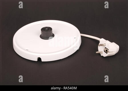 Base unit for electrical kettle isolated on the black background Stock Photo