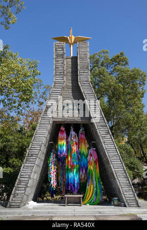 Nagasaki, Japan - October 25, 2018: Origami paper cranes representing peace, at Atomic Bomb Hypocenter, Nagasaki. Japan.   The Nagasaki memorial is to Stock Photo