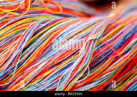 Close-up multicolored cotton yarn for use in handicrafts. Detail and textured background. Stock Photo