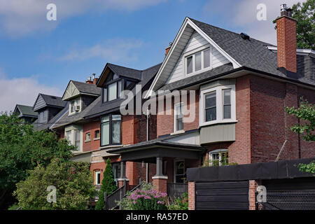 Street of large older houses with gables and dormers Stock Photo