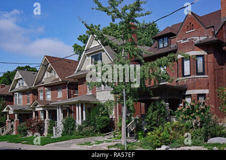 Street of large older houses with gables and dormers Stock Photo