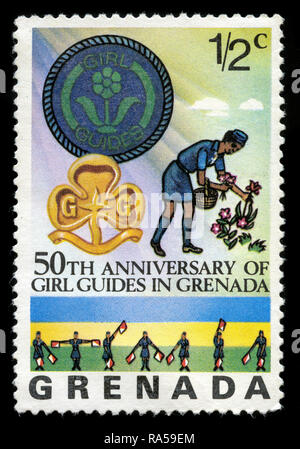 Postage stamp from Grenada in the 50th Anniversary of Girls Guides in Grenada series issued in 1976 Stock Photo