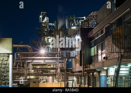 Detailed view of a chemical plant at night. Work at night. Urban landscape in Gouda, The Netherlands. Stock Photo