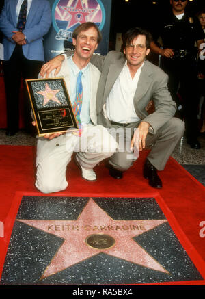 HOLLYWOOD, CA - JULY 15: Actor Keith Carradine and brother actor Robert Carradine attend ceremony for his Star Ceremony on July 15, 1993 on Hollywood Walk of Fame in Hollywood, California. Photo by Barry King/Alamy Stock Photo Stock Photo