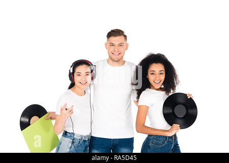 multicultural young people hugging and holding vinyl records isolated on white Stock Photo