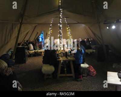 One of the refreshment venues at Waddesdon Manor's Christmas festivities is a wigwam with sheepskin covered seats Stock Photo