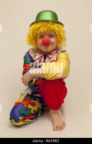 Boy dressed as a clown Stock Photo