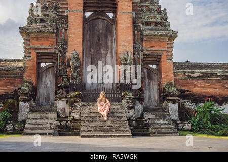 Young woman tourist in Traditional balinese hindu Temple Taman Ayun in Mengwi. Bali, Indonesia Stock Photo